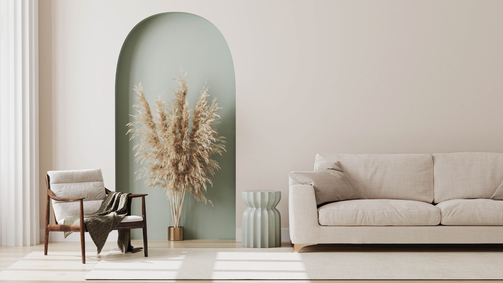 Minimalist living room with pampas grass, armchair, and neutral sofa